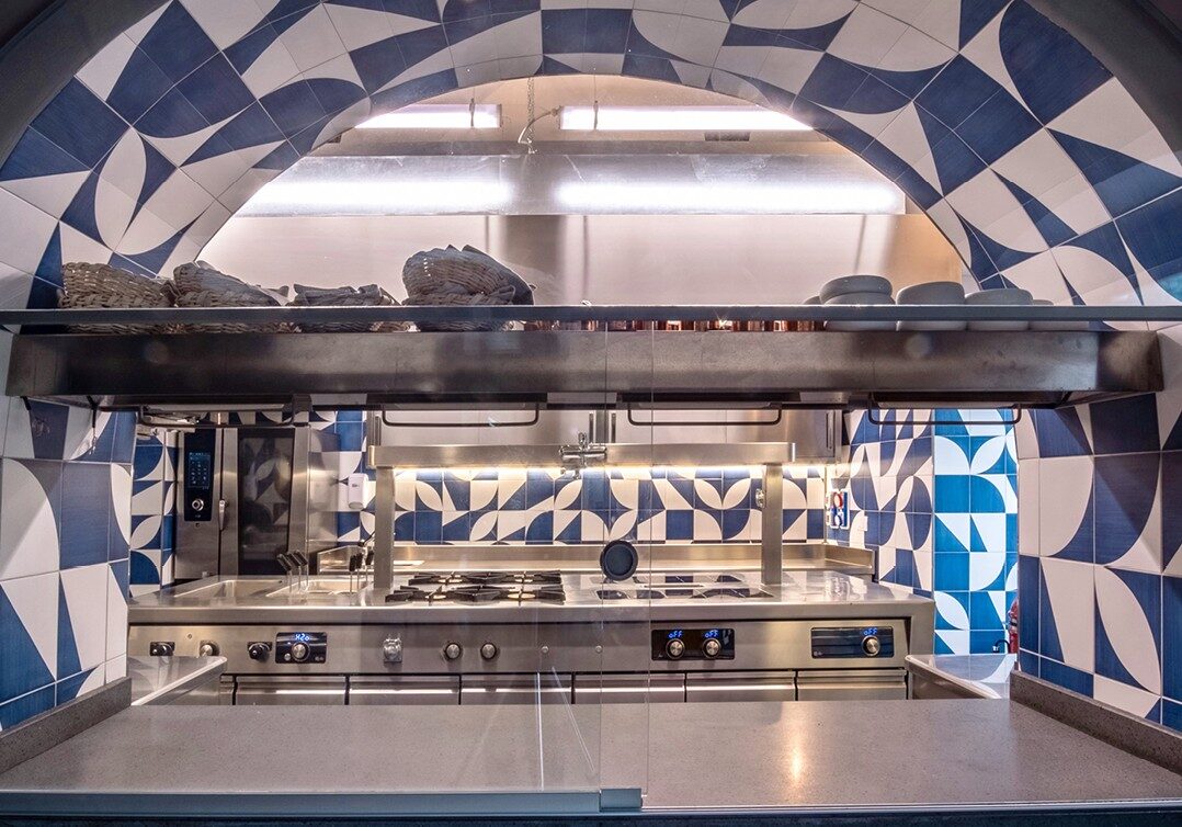 Bespoke cooking suite show kitchen with hand-made tile